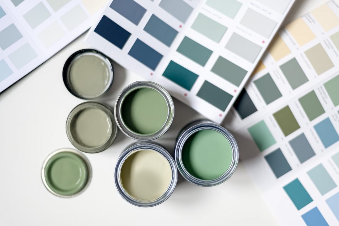 Professional color specialist consulting on wall paint finishes